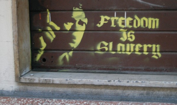 Freedom is slovery - Murales di Bologna